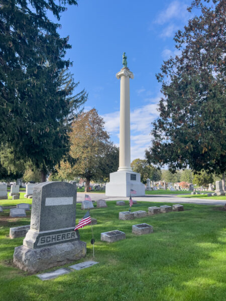 The Capitol Column in Jersey Shore, PA sits among gravestones