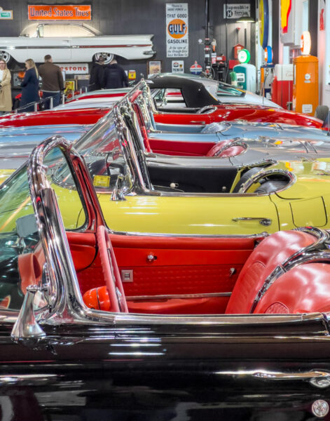 Looking down a row of colorful muscle cars at Barry's Car Barn in Lancaster County PA