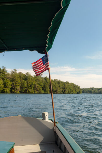 Flapping American flag on the Hardly Able on Eagles Mere Lake in Pennsylvania