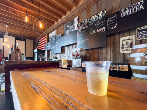 Cider glass sitting on a bar inside Colonel Ricketts Hard Cider in Benton Pennsylvania