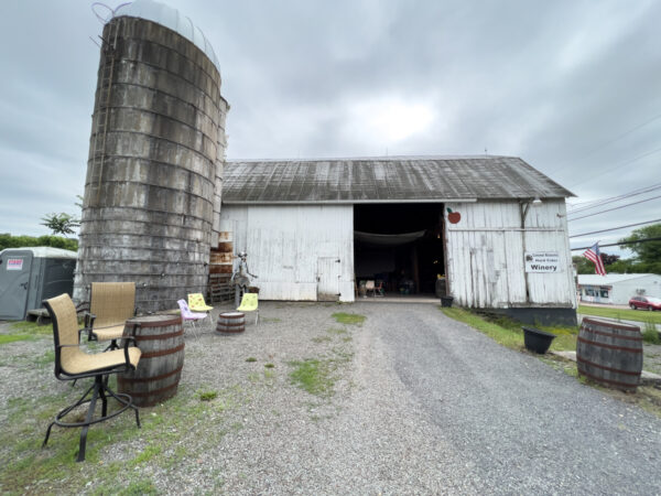 White barn exterior of Colonel Ricketts Hard Cider in Benton PA