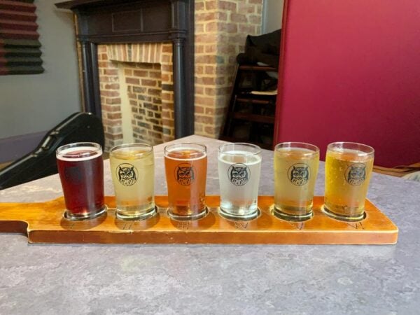A flight of ciders sits on a table at Grand Illusion in Carlisle, PA