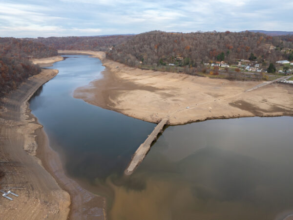 An aerial view of the Youghiogheny River Lake and exposed Great Crossings Bridge in Addison Pennsylvania