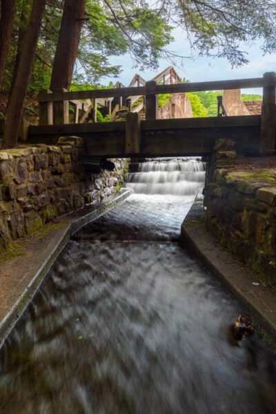 A small dam waterfall below the lake in Penn Roosevelt State Park in Pennsylvania