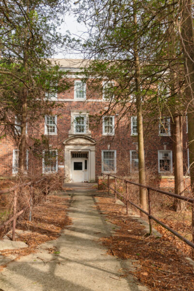Tree lined path to a building on the grounds of the Harrisburg State Hospital in Dauphin County PA