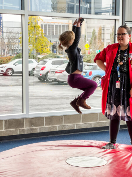 Girl jumping in the air at the Carnegie Science Center in Pittsburgh, PA