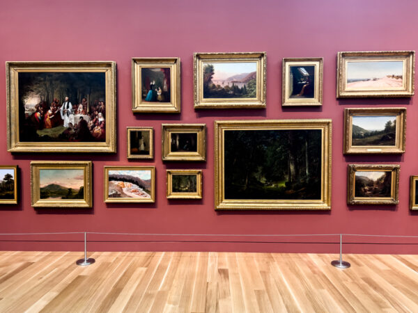 A gallery wall of paintings inside the Palmer Museum of Art in State College, Pennsylvania