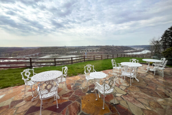 Patio chairs in the foreground with a spectacular view of Pittsburgh in the background from the Bayernhof Museum