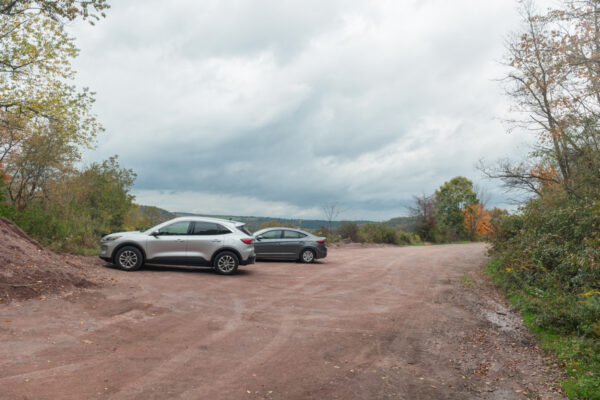 Two cars parked a dirt parking area at the Salisbury Viaduct in Pennsylvania