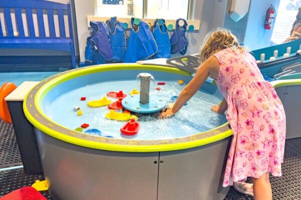 Child playing in the water table at the Bucks County Children's Museum in New Hope, PA