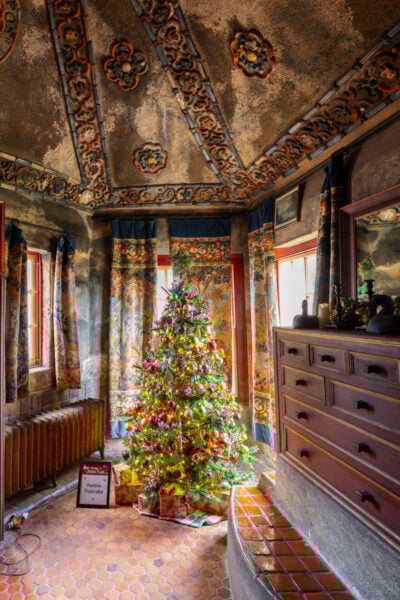 Christmas tree in the middle of a room at Holidays at Fonthill Castle in Doylestown PA
