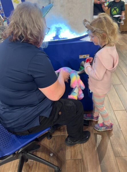 Child building a stuffie at the Build A Bear Workshop in Great Wolf Lodge
