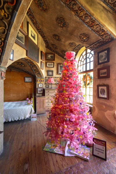 Pink Christmas tree in the middle of Henry Chapman Mercer's bedroom during Holidays at Fonthill Castle in Doylestown PA
