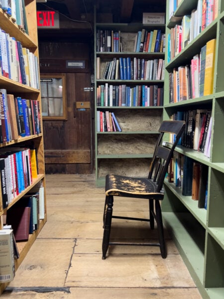 Chair surrounding by books at Baldwin's Book Barn in West Chester PA