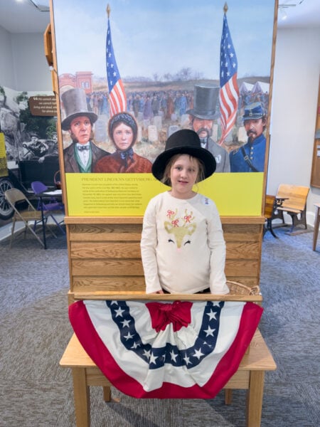 Child in a Lincoln hat reciting the Gettysburg Address at the Children of Gettysburg 1863 Museum in Pennsylvania