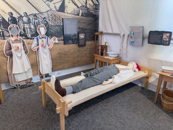 A mannequin laying on a bed in a hospital scene at the Children of Gettysburg 1863 Museum in Adams County Pennsylvania