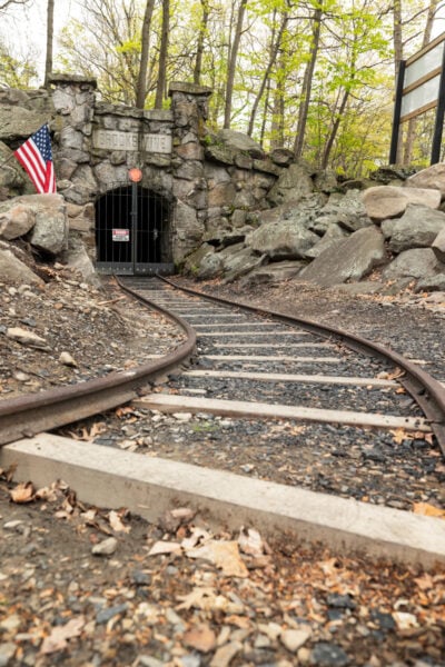 Rails lead to the stone entrance to Brooks Mine in Scranton's Nay Aug Park