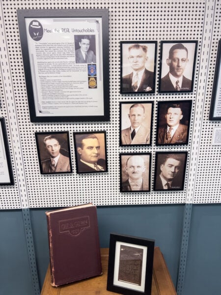 Photos of the Untouchables hanging on the wall at the Eliot Ness Museum in the Pennsylvania Wilds