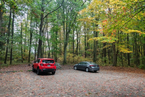 Several cars in the parking area for Baughman Rock Overlook in Ohiopyle State Park in Fayette County PA