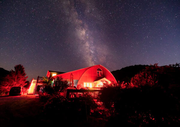 Milky Way over the red-lit barn of Frosty Hollow Bed and Breakfast near Coudersport, PA